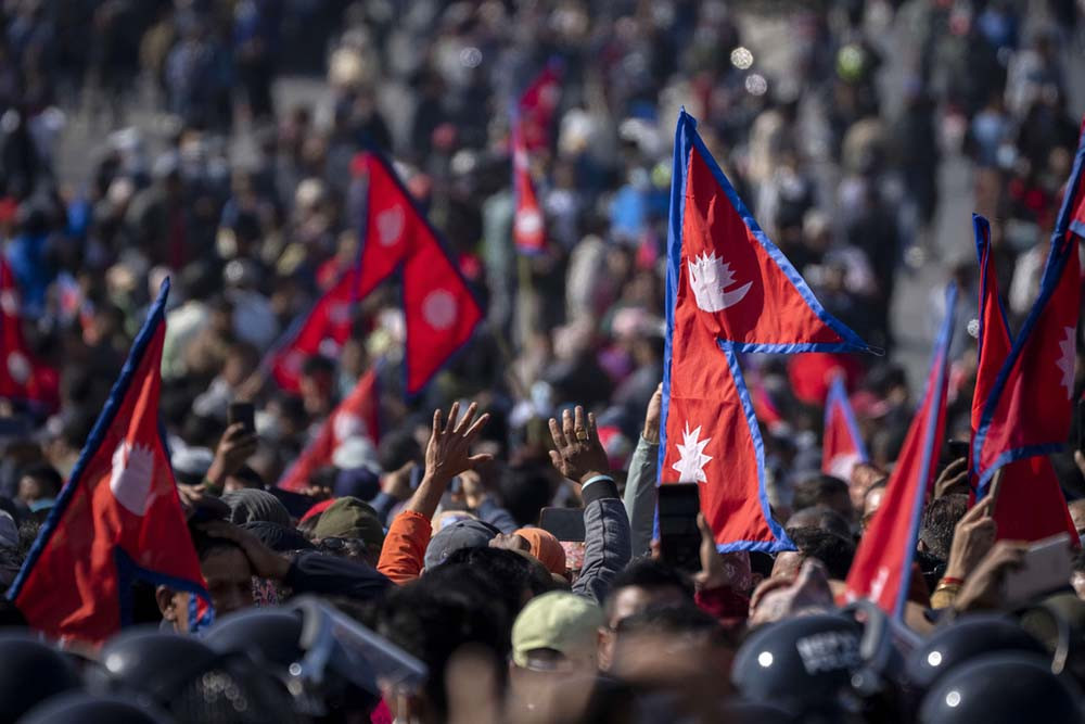 Tens of thousands of protesters demanding restoration of monarchy clash with police